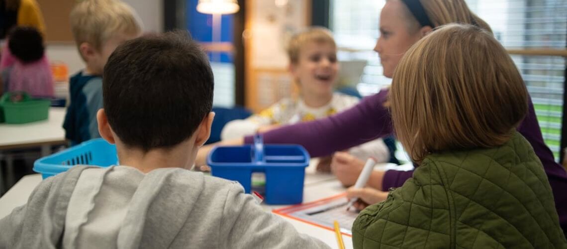 children drawing in a classrom